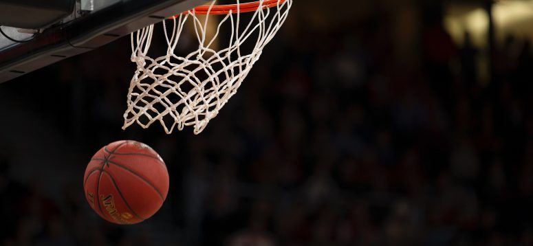 Basketball going through a hoop