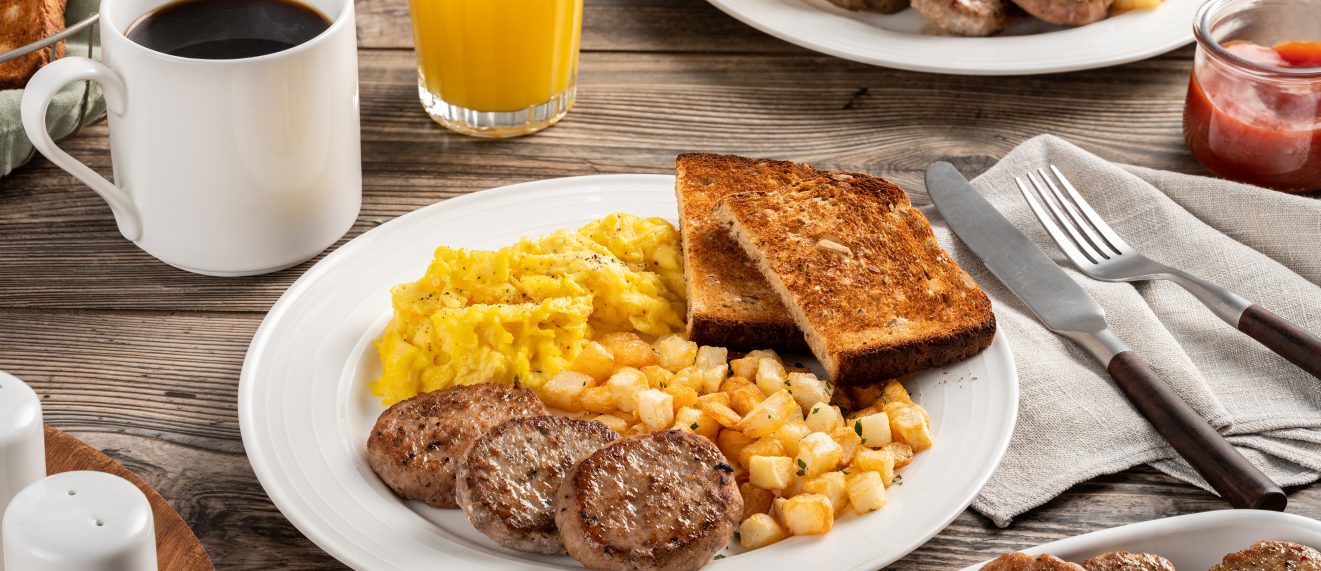 Pork Sausage Breakfast Patties plated with eggs, veggies and toast